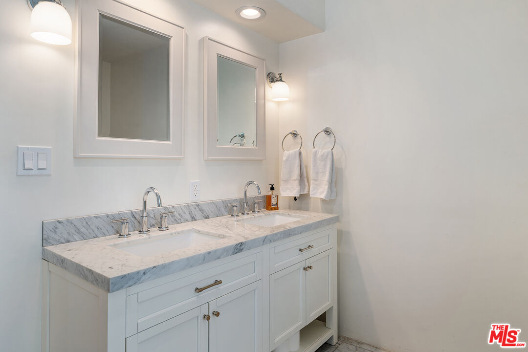 2382 Live Oak Meadows Road Malibu, CA 90265 - Photo 33 of 50 a bathroom with a sink and a mirror