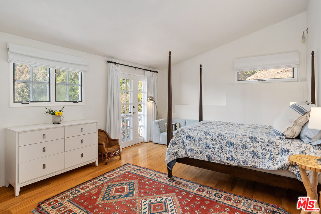 2382 Live Oak Meadows Road Malibu, CA 90265 - Photo 34 of 50 a bedroom with a bed and a dresser