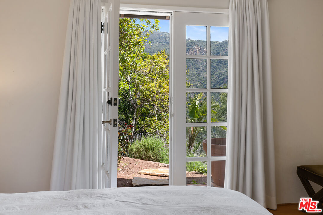 2382 Live Oak Meadows Road Malibu, CA 90265 - Photo 36 of 50 a view of a balcony with garden