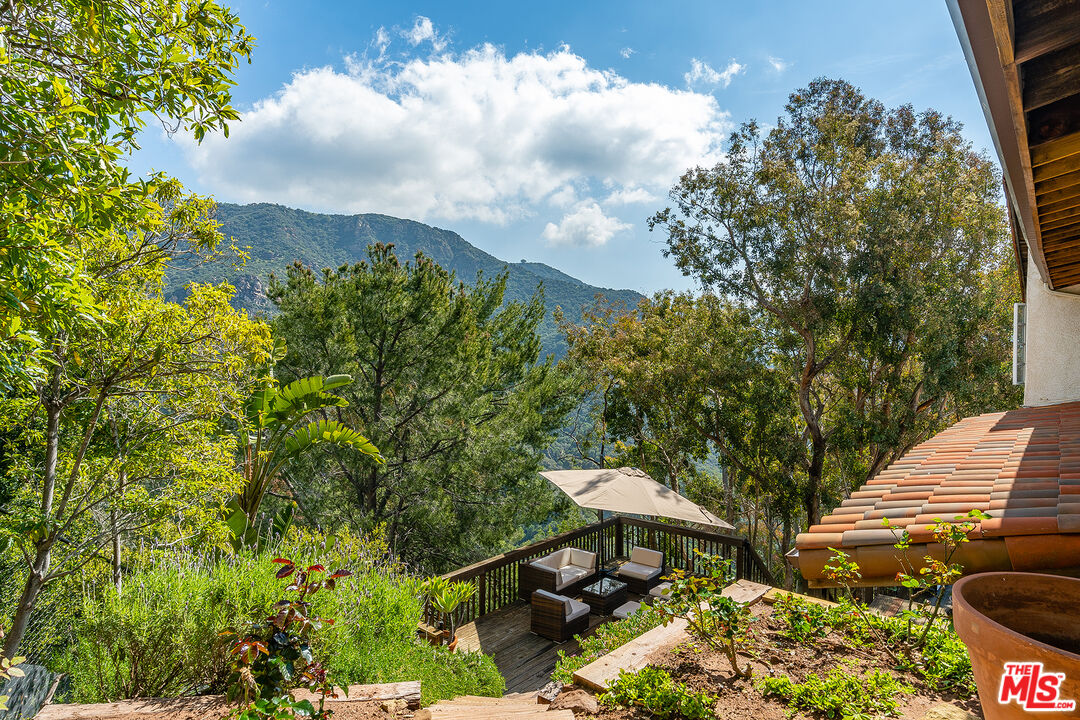 2382 Live Oak Meadows Road Malibu, CA 90265 - Photo 37 of 50 a garden view with a seating space