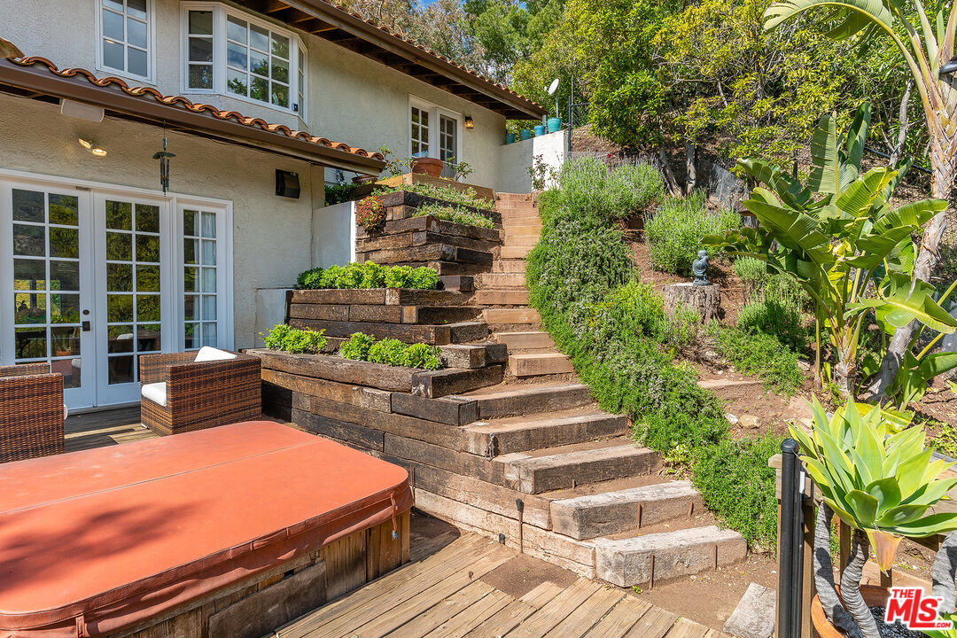 2382 Live Oak Meadows Road Malibu, CA 90265 - Photo 39 of 50 a front view of a house with a garden