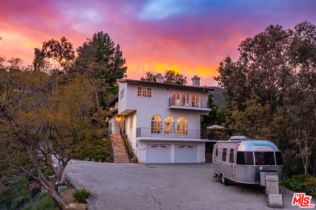 2382 Live Oak Meadows Road Malibu, CA 90265 - Photo 46 of 50 a front view of a house with a yard
