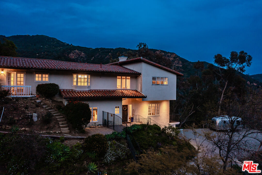 2382 Live Oak Meadows Road Malibu, CA 90265 - Photo 48 of 50 a front view of a house with a yard