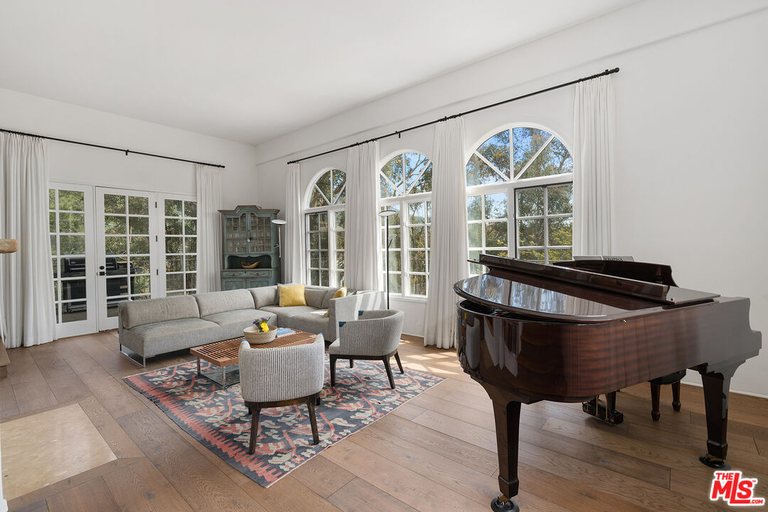 2382 Live Oak Meadows Road Malibu, CA 90265 - Photo 6 of 50 a living room with furniture and a large window