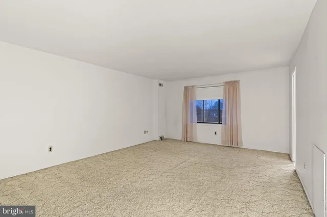 a view of an empty room and window