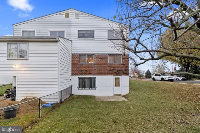 a view of an empty room with windows