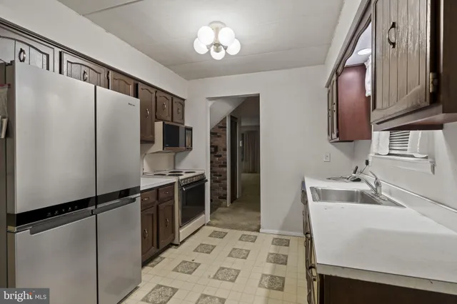 a bathroom with a sink a vanity and a mirror