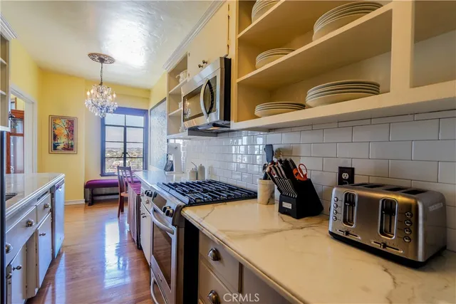 a kitchen with a stove and a microwave