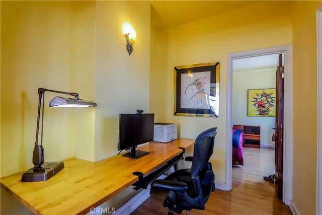 a bedroom with a bed and a table