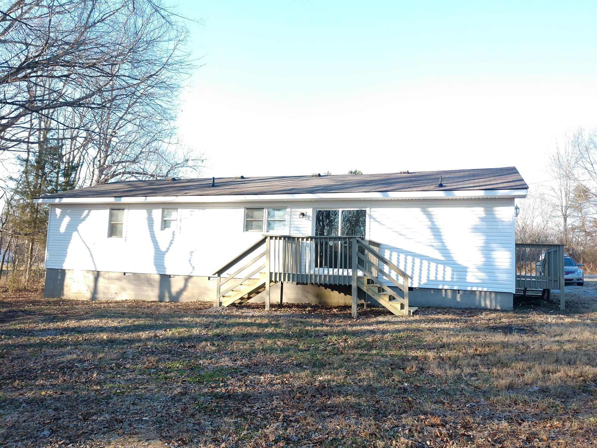 1240 Black Road Cunningham, TN 37052 - Photo 12 of 12 a view of a house with a yard