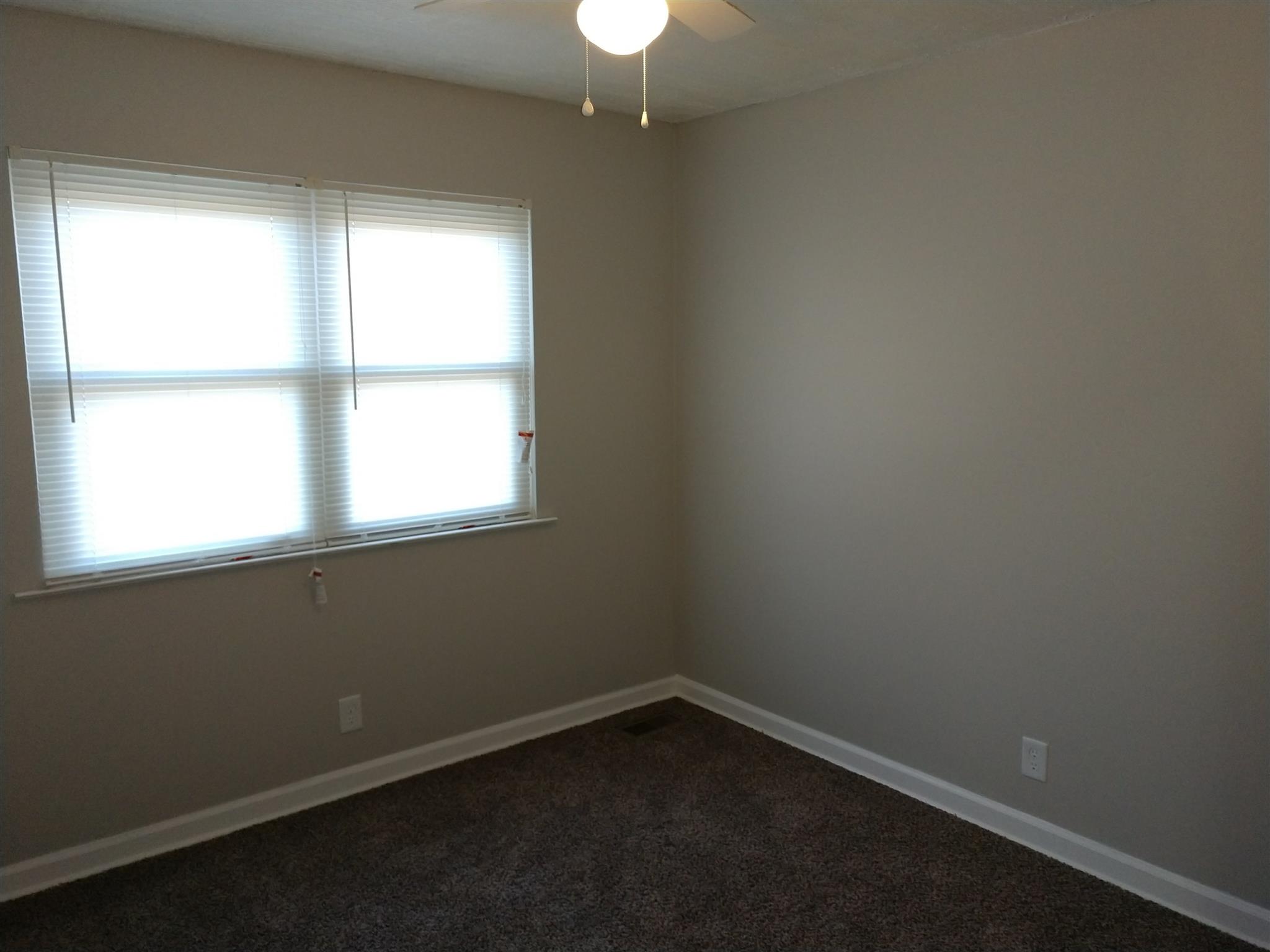 1240 Black Road Cunningham, TN 37052 - Photo 5 of 12 an empty room with a window
