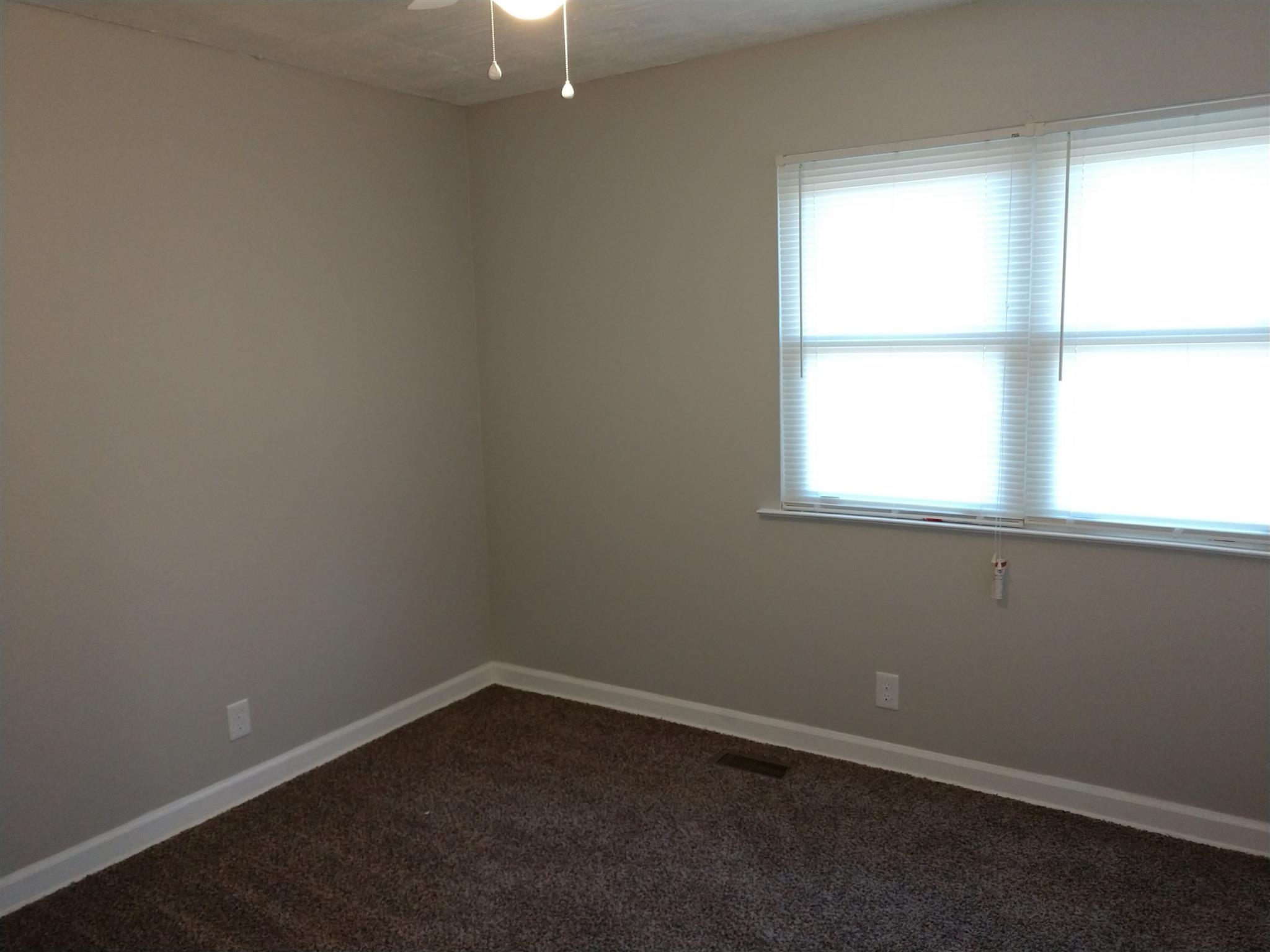 1240 Black Road Cunningham, TN 37052 - Photo 7 of 12 an empty room with a window