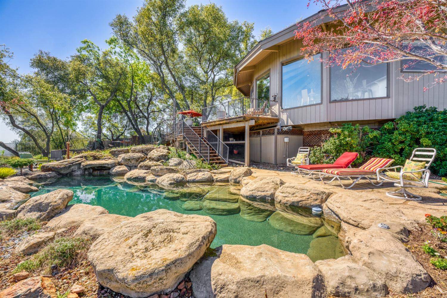5161 Coyote Pass Road Shingle Springs, CA 95682 - Photo 31 of 48 a view of a house with backyard porch and sitting area