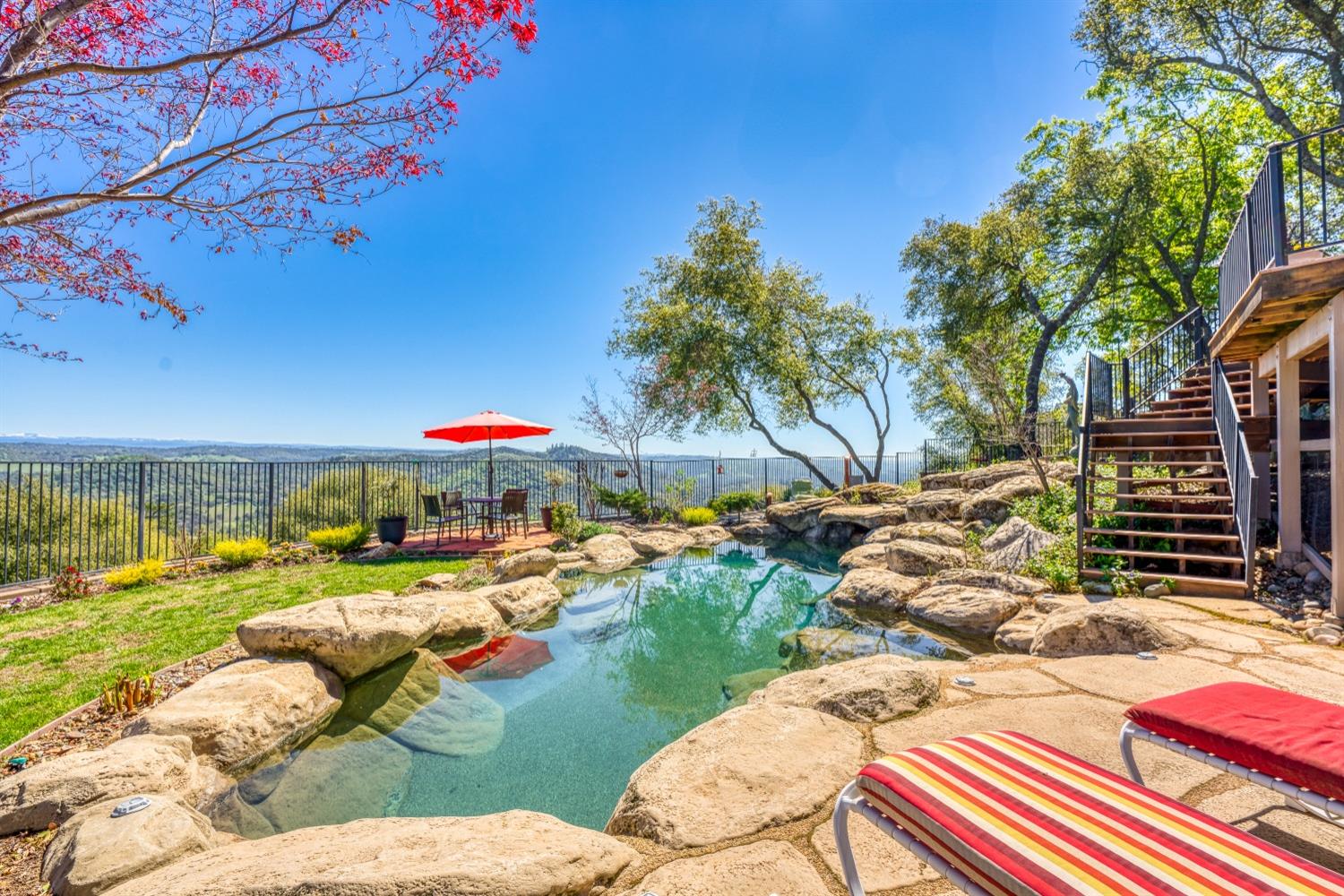 5161 Coyote Pass Road Shingle Springs, CA 95682 - Photo 32 of 48 a view of a backyard with plants and patio