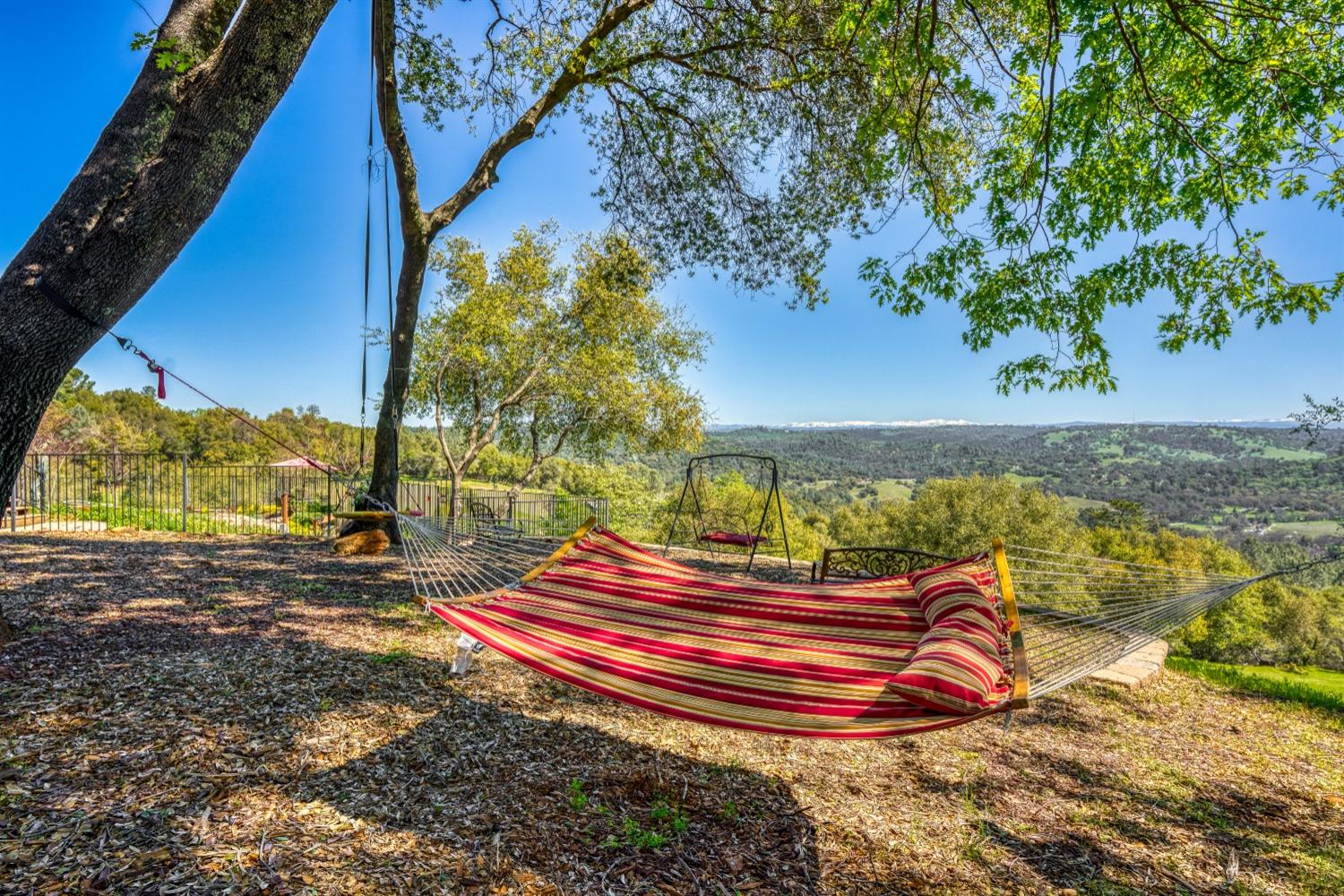 5161 Coyote Pass Road Shingle Springs, CA 95682 - Photo 39 of 48 a view of a backyard with wooden fence