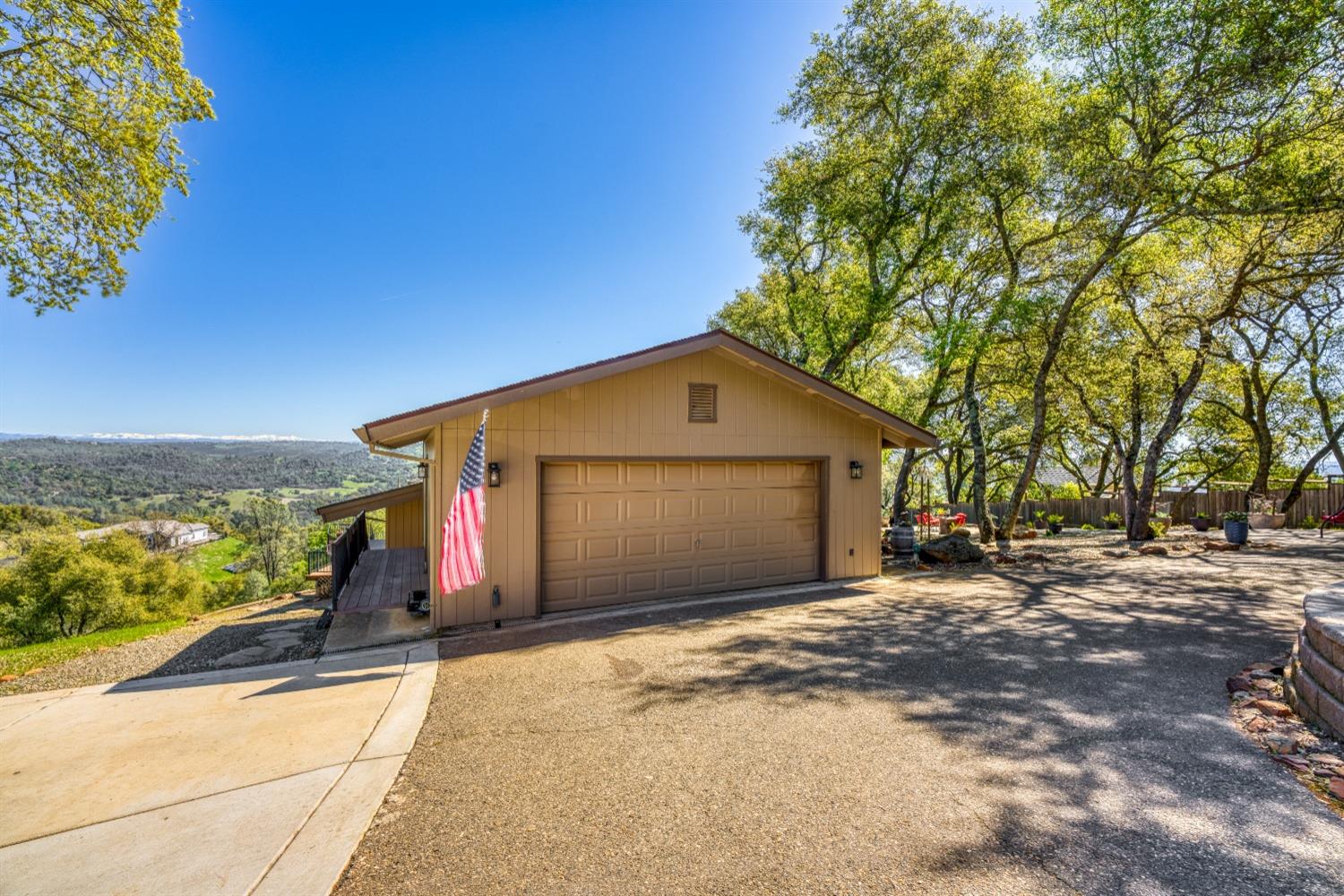 5161 Coyote Pass Road Shingle Springs, CA 95682 - Photo 45 of 48 a view of a house with a yard