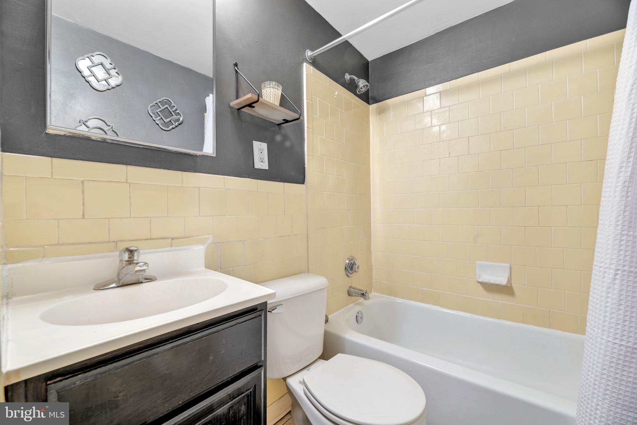 1436 W Street Northwest, Unit 405 Washington, DC 20009 - Photo 11 of 13 a bathroom with a sink toilet and shower