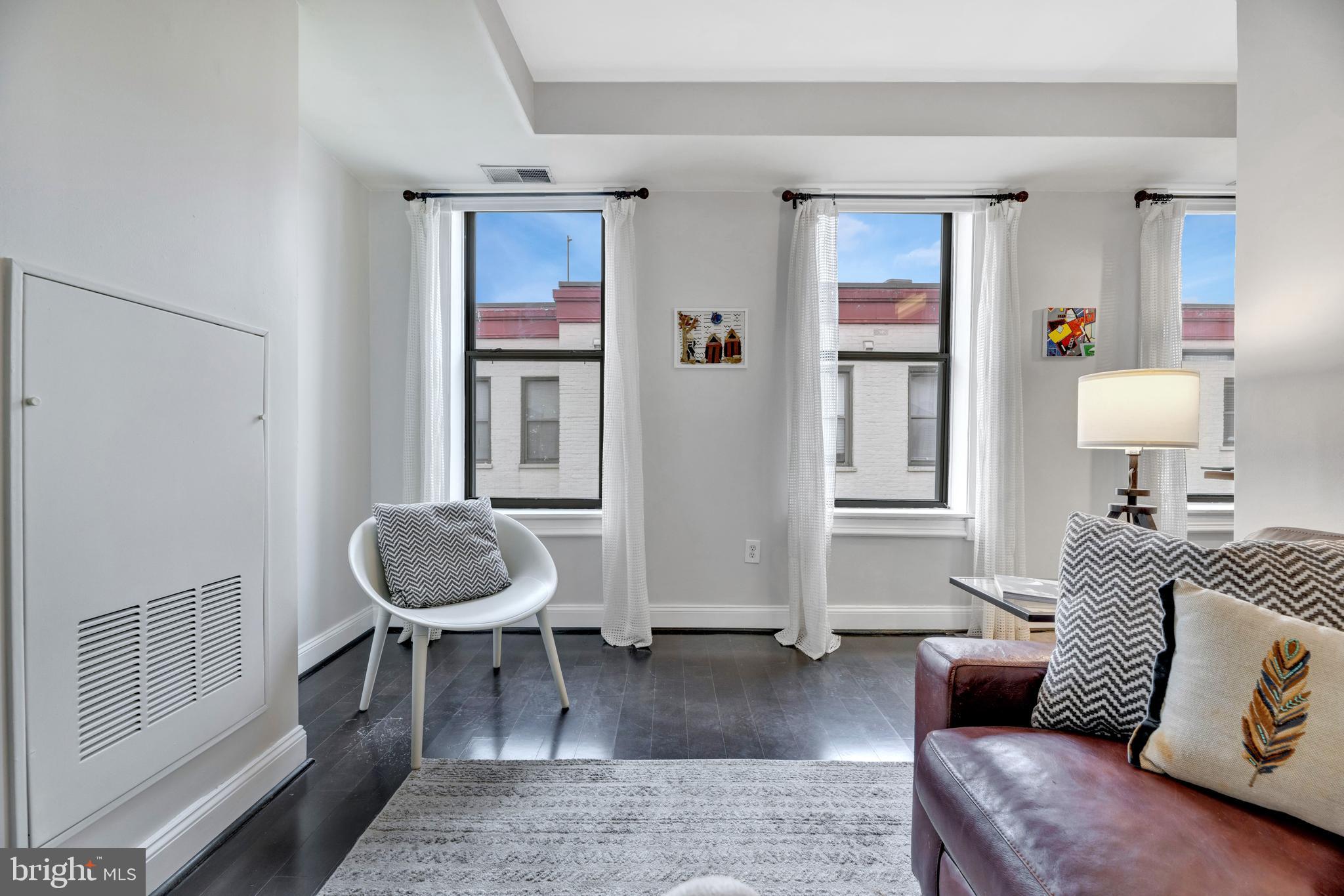 1436 W Street Northwest, Unit 405 Washington, DC 20009 - Photo 9 of 13 a living room with furniture and a window