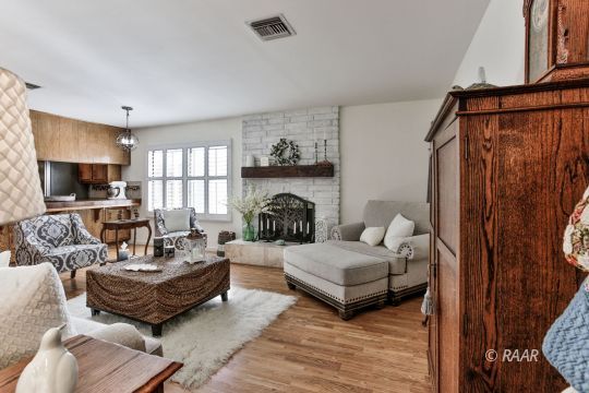 928 Randall Street Ridgecrest, CA 93555 - Photo 9 of 34 a living room with furniture and a fireplace