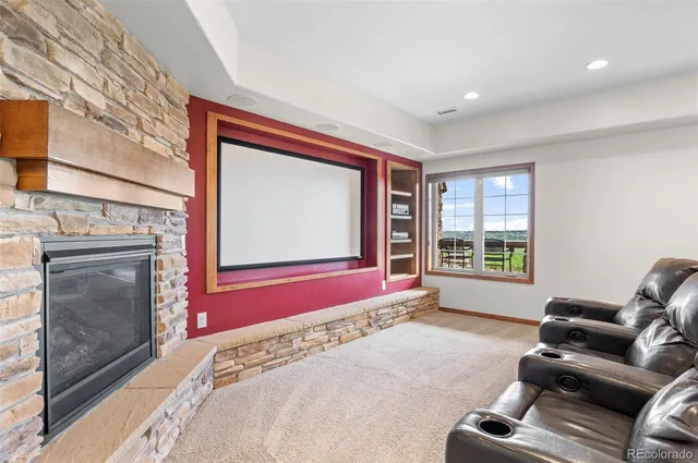 a living room with furniture kitchen and a wooden floor