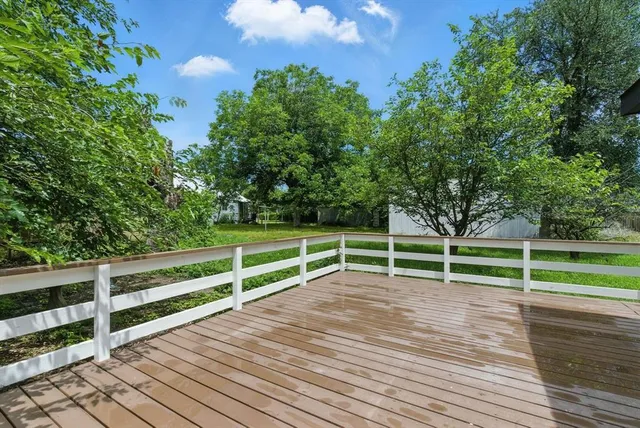 a view of outdoor space with deck and yard