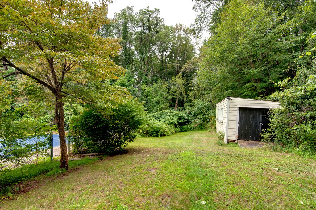 112 Wallace Road Sturbridge, MA 01566 - Photo 13 of 30 a view of a backyard with large trees