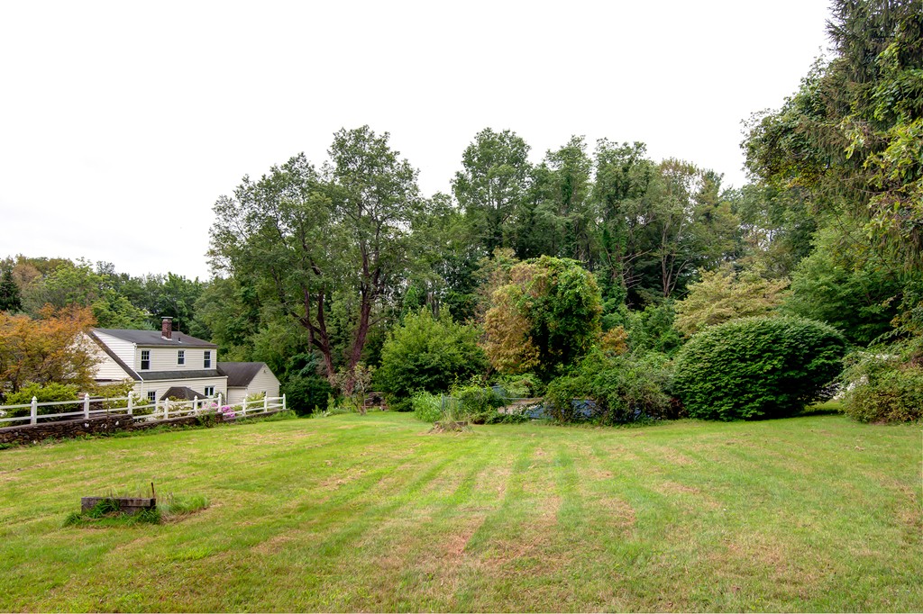 112 Wallace Road Sturbridge, MA 01566 - Photo 14 of 30 a view of a house with swimming pool and garden