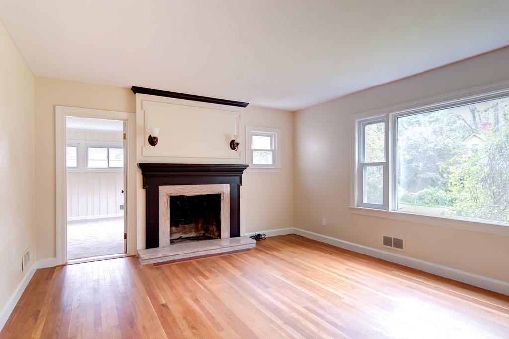112 Wallace Road Sturbridge, MA 01566 - Photo 20 of 30 an empty room with wooden floor fireplace and windows