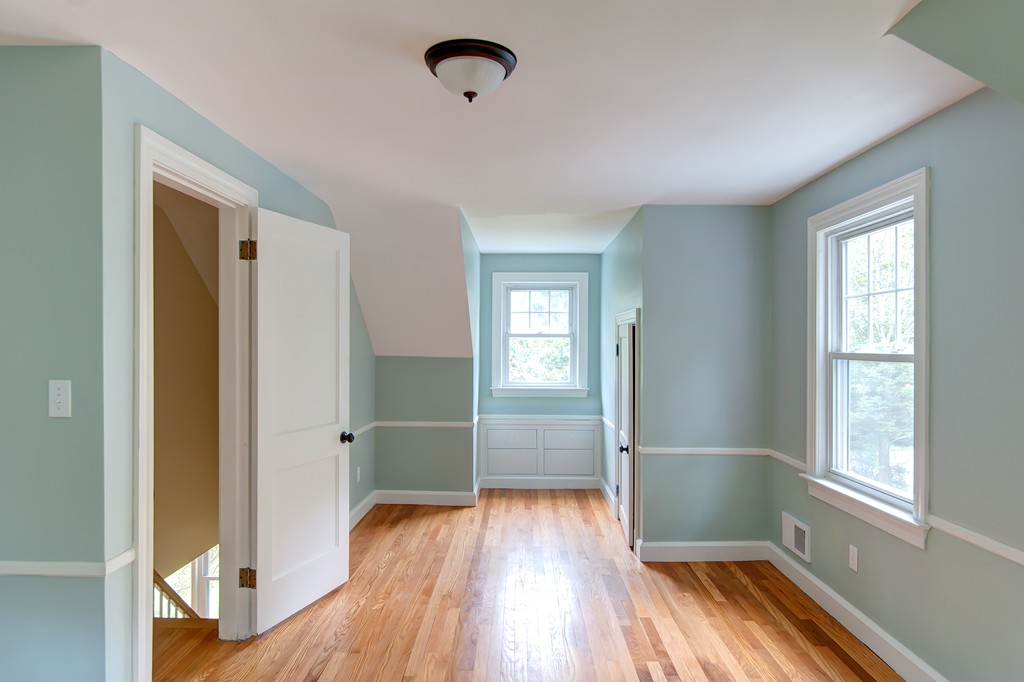 112 Wallace Road Sturbridge, MA 01566 - Photo 24 of 30 a view of hallway with a large window and wooden floor