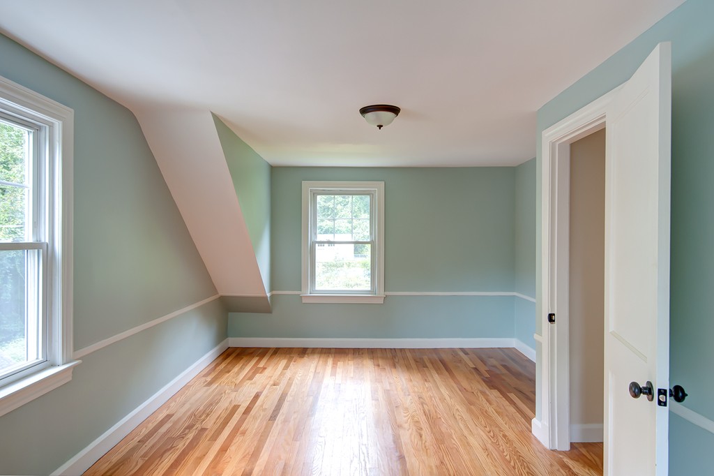 112 Wallace Road Sturbridge, MA 01566 - Photo 25 of 30 an empty room with wooden floor and windows