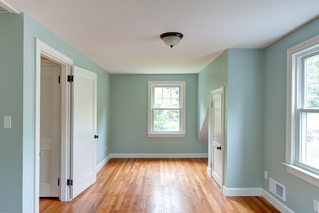 112 Wallace Road Sturbridge, MA 01566 - Photo 27 of 30 a view of an empty room with wooden floor and a window