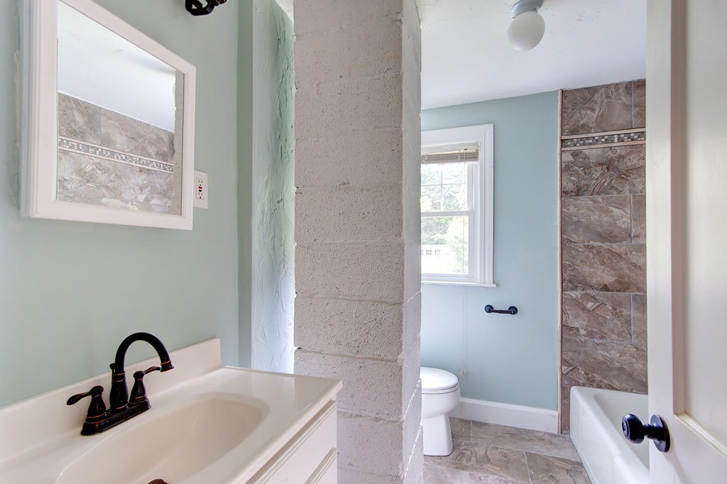 112 Wallace Road Sturbridge, MA 01566 - Photo 28 of 30 a bathroom with a toilet sink and shower