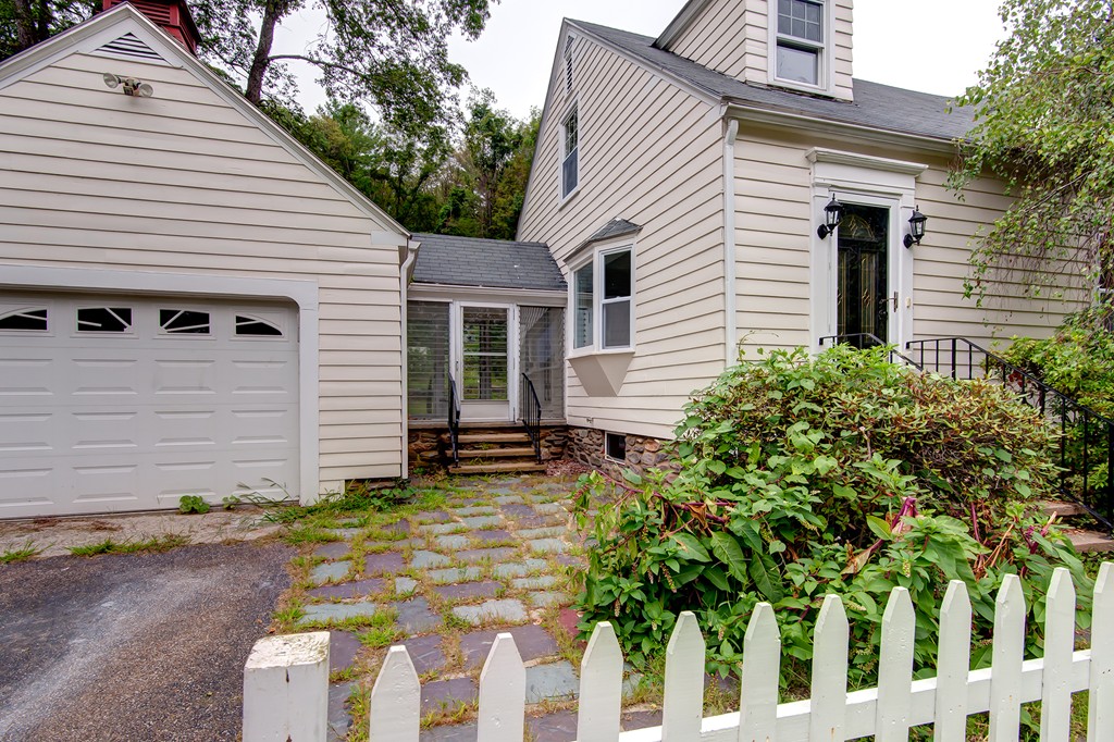 112 Wallace Road Sturbridge, MA 01566 - Photo 3 of 30 a view of a white house with yard and plants