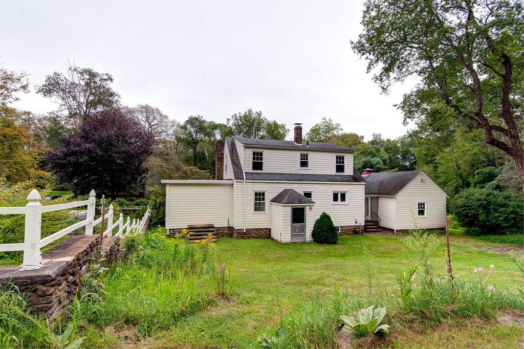 112 Wallace Road Sturbridge, MA 01566 - Photo 8 of 30 a view of a house with backyard and garden