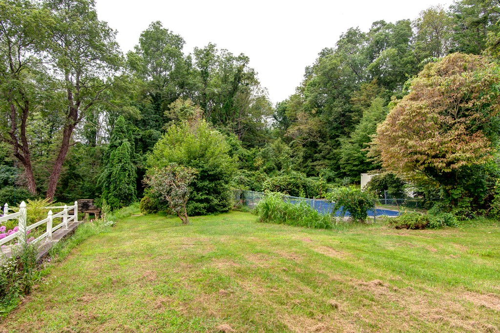 112 Wallace Road Sturbridge, MA 01566 - Photo 9 of 30 a view of green field with trees in the background