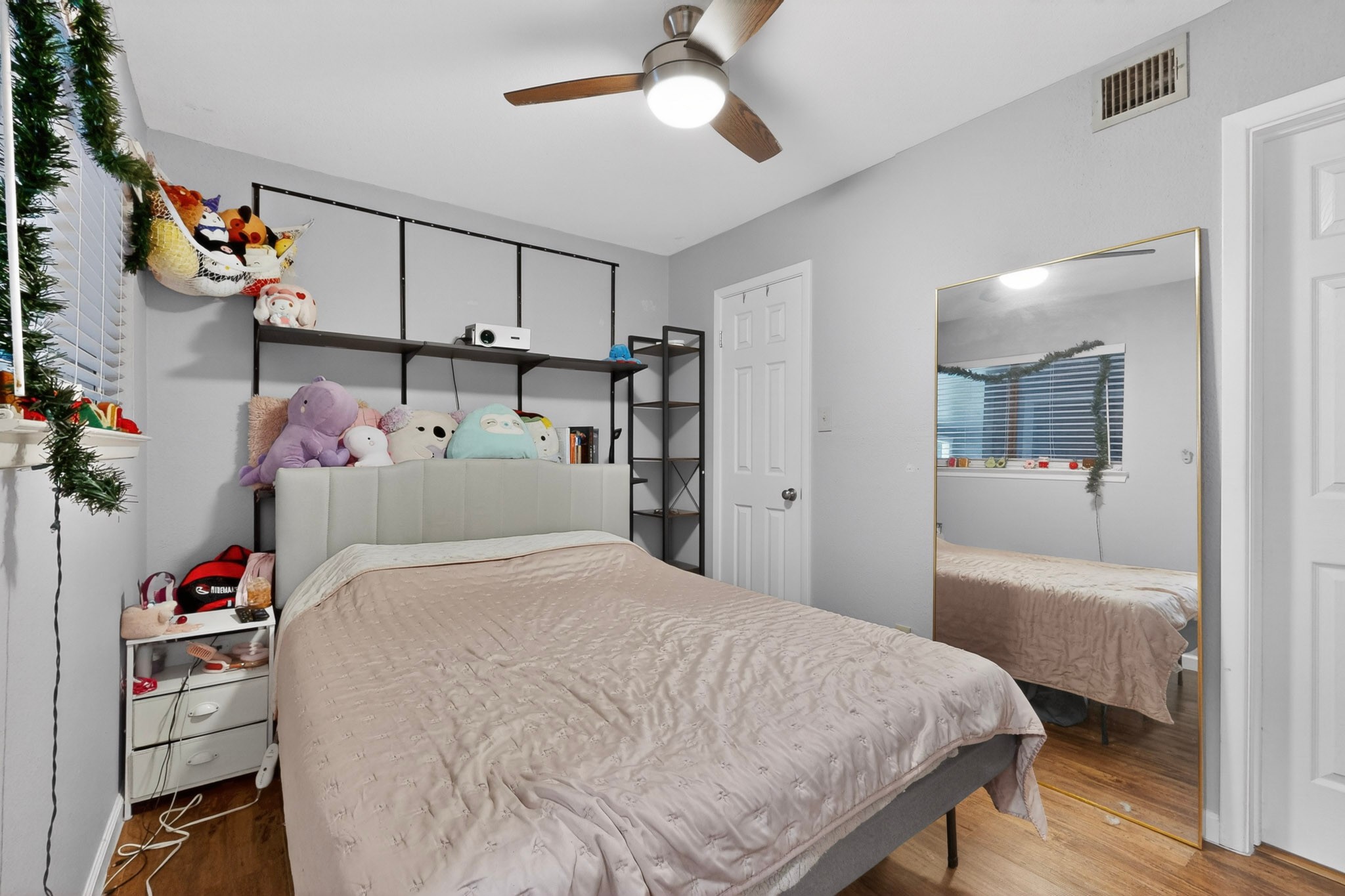 2500 Burleson Road, Unit 506 Austin, TX 78741 - Photo 14 of 23 a bedroom with a bed and a large walk in closet