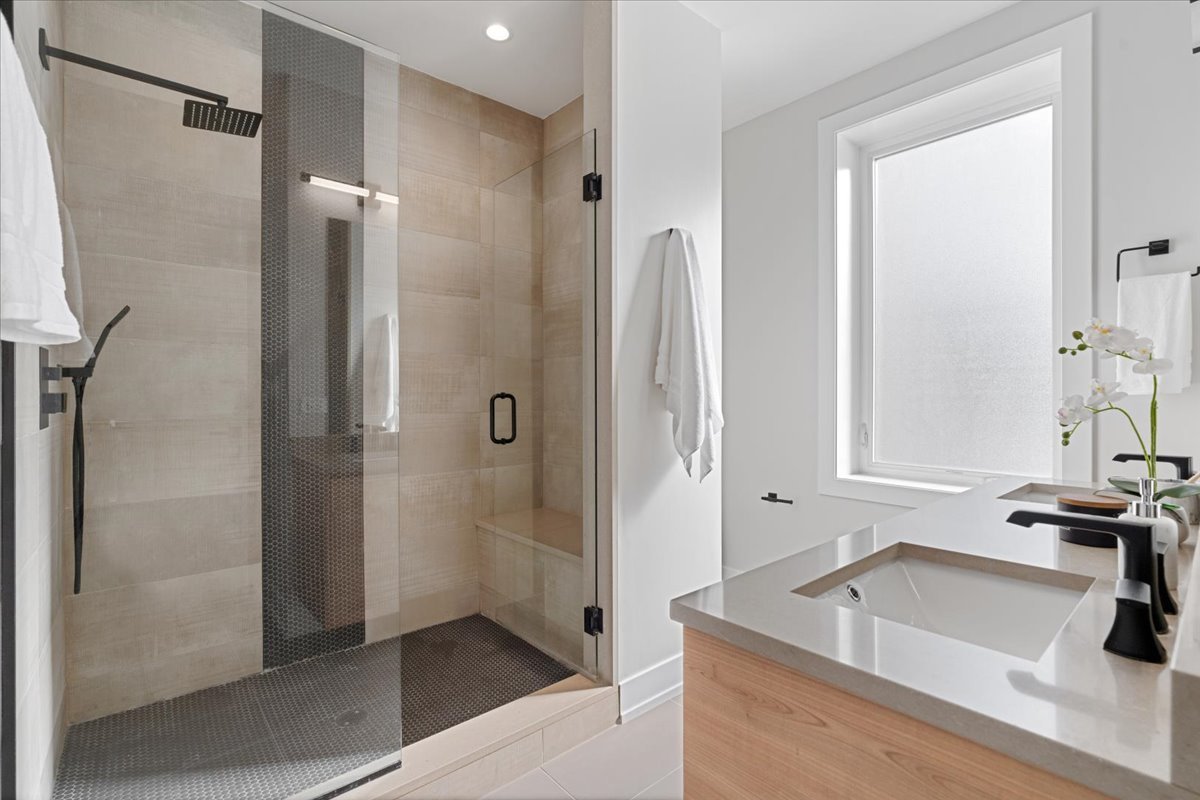 3653 West Barry Avenue, Unit 2W Chicago, IL 60618 - Photo 18 of 27 a bathroom with a tub sink and shower