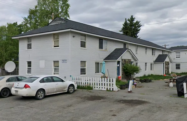a view of a car park in front of house