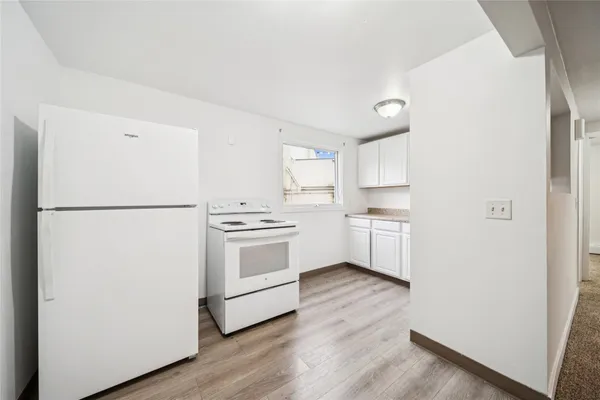 a kitchen with stainless steel appliances granite countertop a sink and cabinets