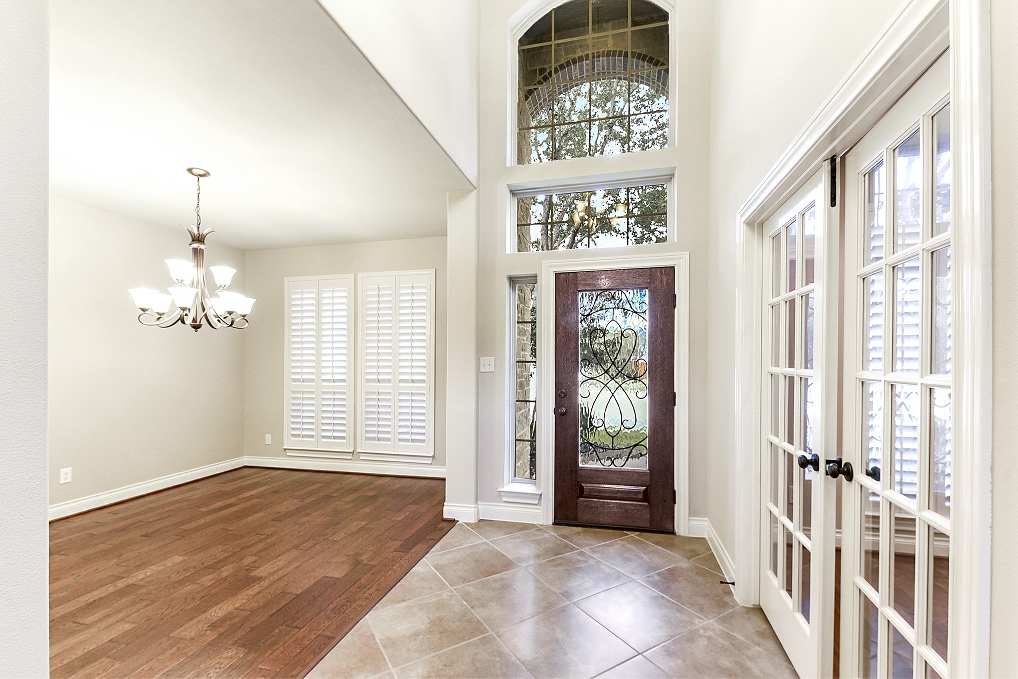 29023 Powder Ridge Drive Katy, TX 77494 - Photo 6 of 50 As you enter this stunning home, you’ll immediately notice the freshly painted walls throughout. The main living areas feature tile flooring, while the formal dining room, home office, and primary en suite showcase beautiful wood flooring. From the entry, the spacious home office is to the right, while the formal dining room is also conveniently located nearby. The generous breakfast room provides plenty of space for everyday dining, allowing the formal dining room to also be used as an additional seating o