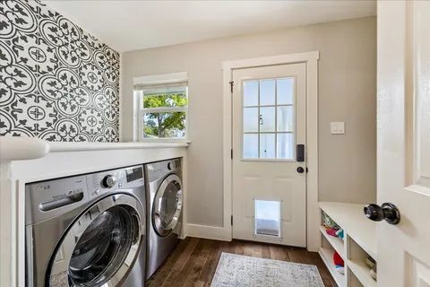 a bathroom with a double vanity sink and a mirror