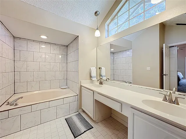 a bathroom with a bathtub and a sink