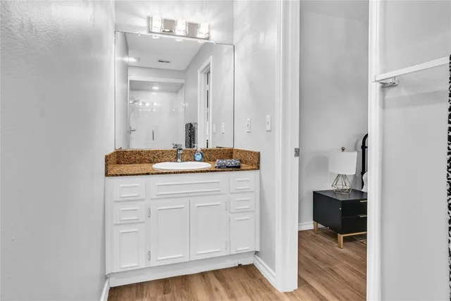 a bathroom with a sink and a mirror