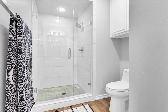 a bathroom with a bathtub and a shower