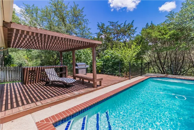 a view of a wooden deck with a patio