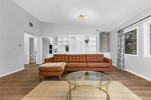 a living room with furniture and a couch