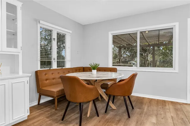 a view of a dining room with furniture window and outside view