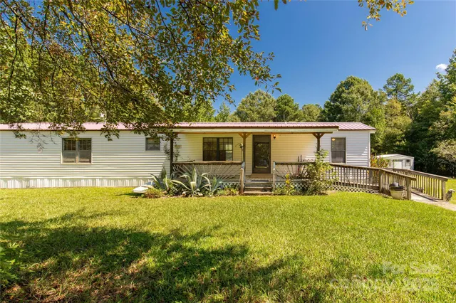 a view of a house with swimming pool