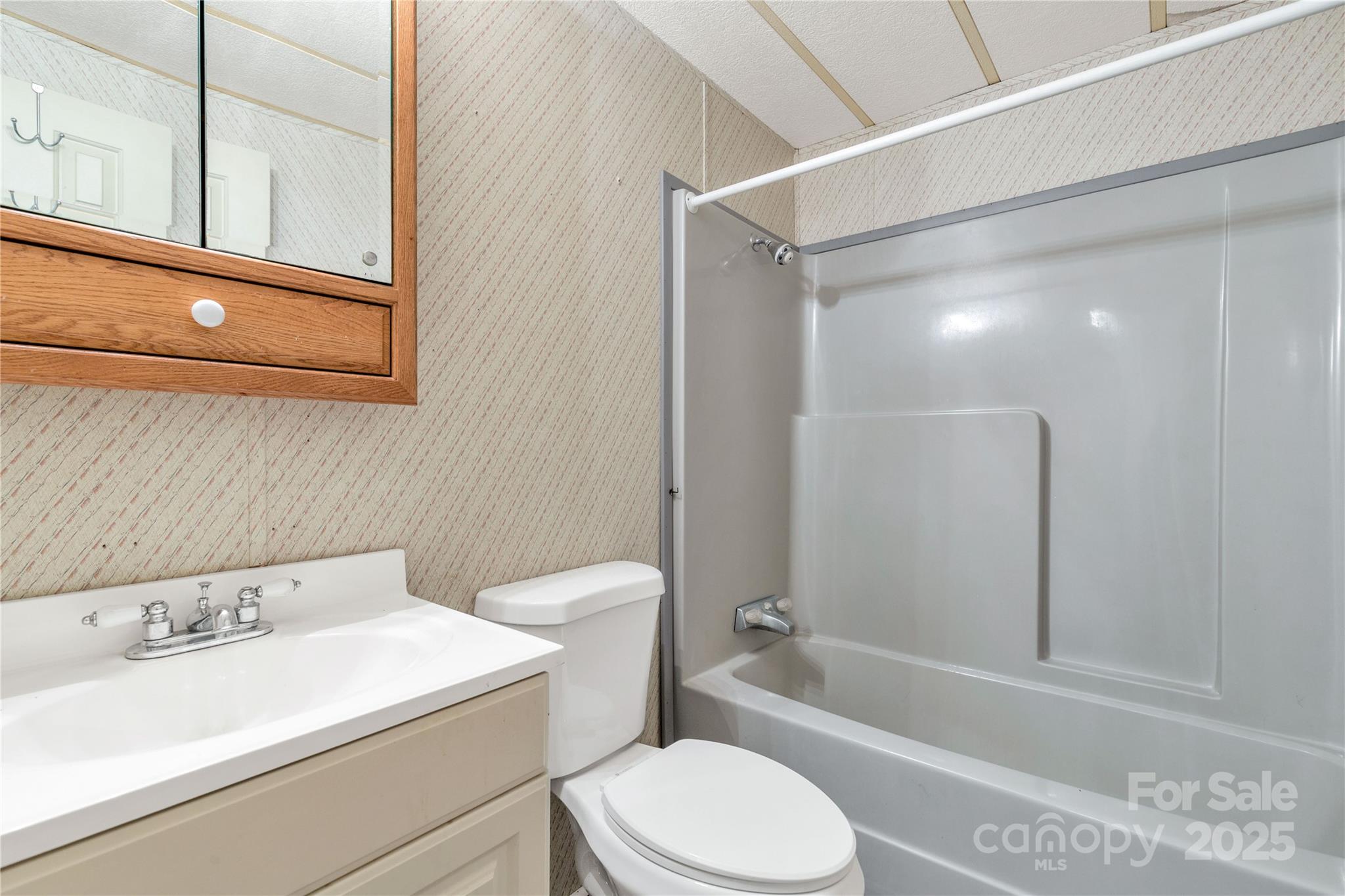 4331 Palmer Lloyd Road, Unit 11 Lancaster, SC 29720 - Photo 15 of 36 a bathroom with a sink a toilet and shower