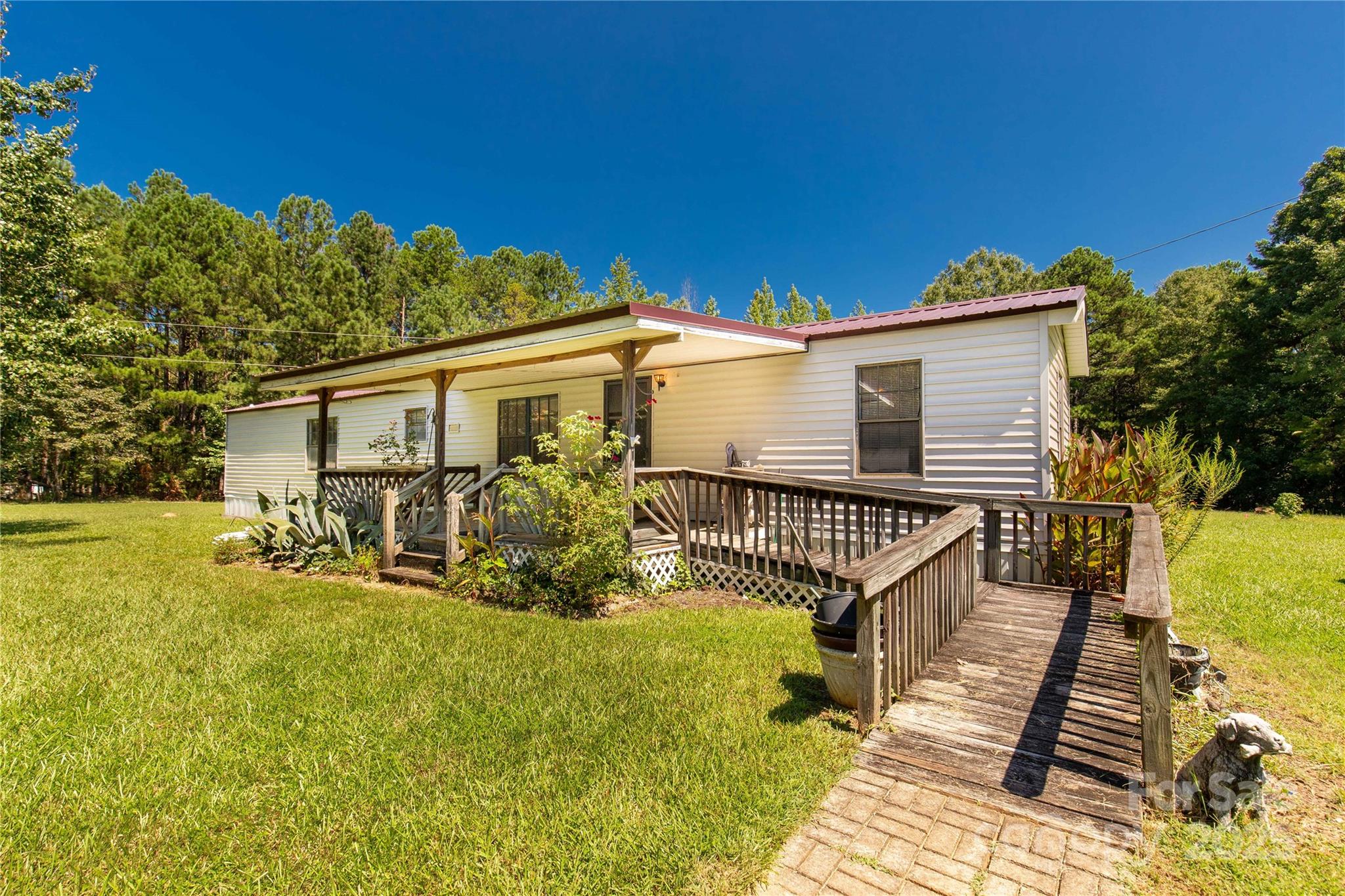 4331 Palmer Lloyd Road, Unit 11 Lancaster, SC 29720 - Photo 2 of 36 a view of a house with wooden fence